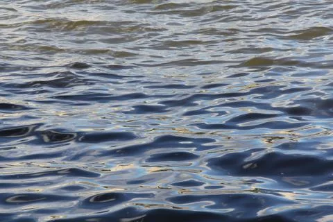 The waves are completely different colors of one river Stock Photos