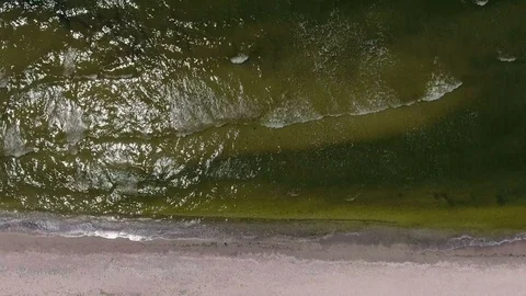 Waves are gently washing up the beach sand, Stock Footage 82150586