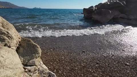 Waves are lapping at the beach Stock Footage 299902373