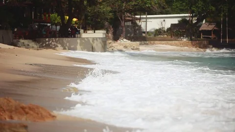 The waves are rolling on a pebble stone beach. 1920x1080 Stock Footage