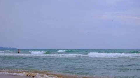 Waves are rolling on a sand sea beach. Stock Footage 168981545