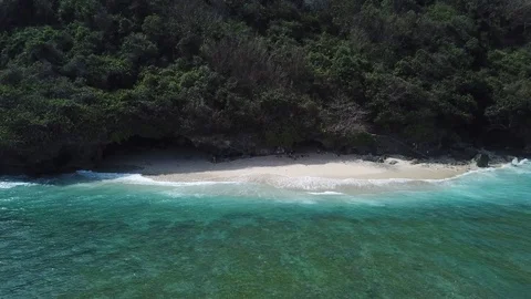Waves Arriving on Small Secluded Beach [Drone Footage] Stock Footage 96237119