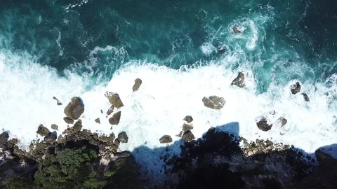 Waves Arriving on Steep Cliffs From Above [Drone Footage] Stock Footage 96236106