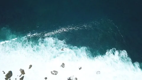 Waves Arriving on Steep Cliffs From Above [Drone Footage] Stock Footage 96248671