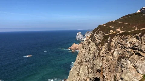 Waves of the Atlantic Ocean and lighthouse in Cabo da Roca, Portugal. Stock Footage 118087190