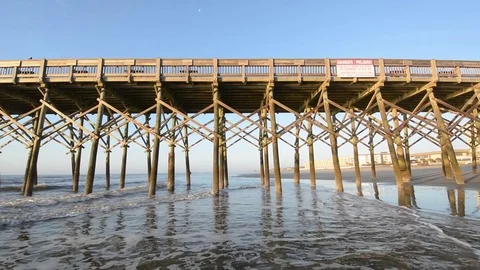 Waves in the Atlantic Ocean and the pier, at Folly Beach, near Charleston, South Stock Footage 71636832