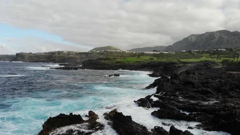 Waves of the Atlantic ocean beat against the rocky shore, top view. Sea surf big Stock Footage 102303688