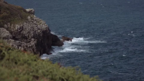 The waves of the Atlantic Ocean beat against the rocks Stock Footage 159298584