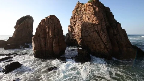 Waves of Atlantic Ocean Breaking the Rocks at sunset Stock Footage 79340881