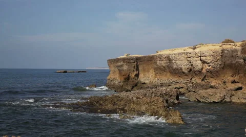 Waves of  Atlantic Ocean understand about rocks at coast of Portugal Stock Footage 47242176