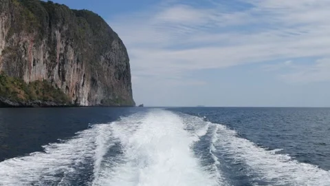 Waves from the back of speed boat out of the island view. Stock Footage 149088560