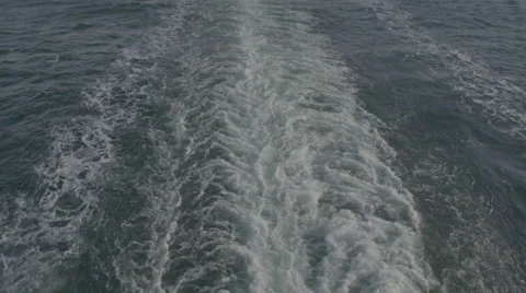 Waves from the back of a yacht Stock Footage 64555733