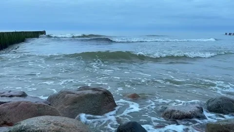 The waves of the Baltic Sea are beating against the rocks on the shore. Stock Footage 272213069