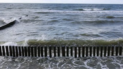 The waves of the baltic sea are breaking on the breakwaters, slow motion 4k Stock Footage 201620914