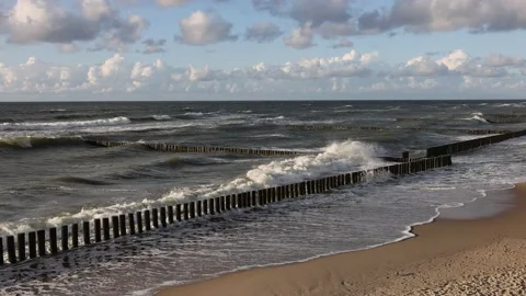 The waves of the baltic sea are breaking on the breakwaters, slow motion 4k Stock Footage 201865860