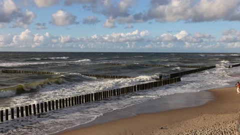 The waves of the baltic sea are breaking on the breakwaters, slow motion 4k Stock Footage 202072014