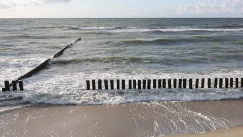 The waves of the baltic sea are breaking on the breakwaters, slow motion 4k Stock Footage 202912664