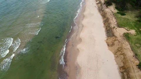 Waves of the Baltic Sea roll onto the shore. View from above. Sea surf. Stock Footage 300077755