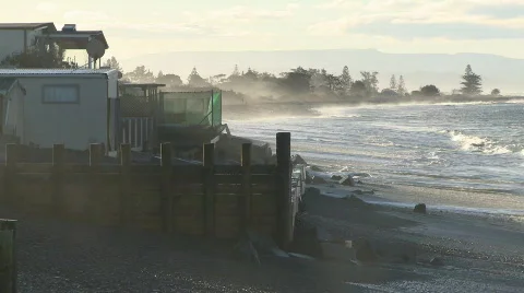 Waves batter seaside properties Stock Footage 377508