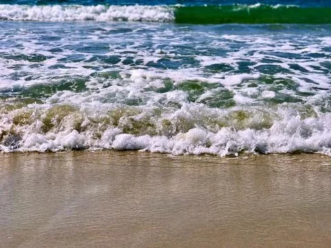 Waves on the beach close up Foto stock