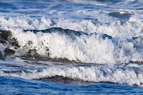 Waves on the beach of Denia Stock Photos