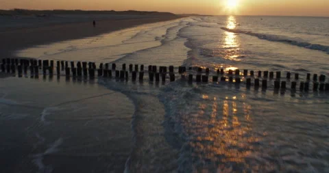 Waves beach flyover aerial sunset 4k Video stock 153501343