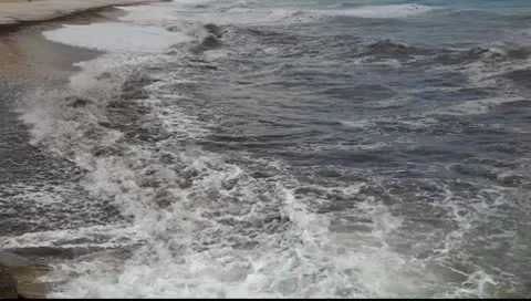 Waves at the beach Видео 8949417