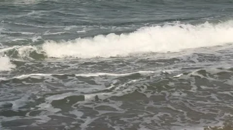 Waves on a beach Stock Footage 10573933