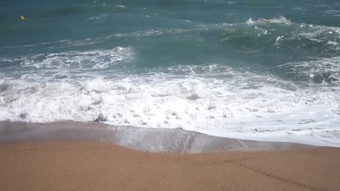 Waves on a beach Stock Footage 104458339