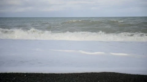 Waves on a beach Stock Footage 243422064
