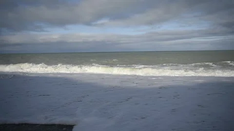 Waves on a beach Stock Footage 243422096