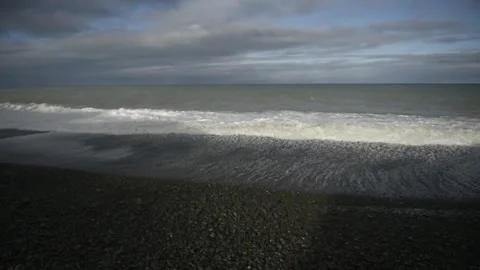 Waves on a beach Stock Footage 243422158