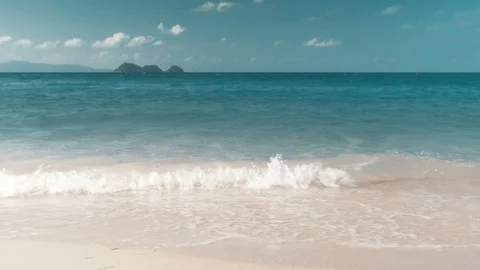 Waves on the beach, the islands on the horizon Stock Footage 87495389