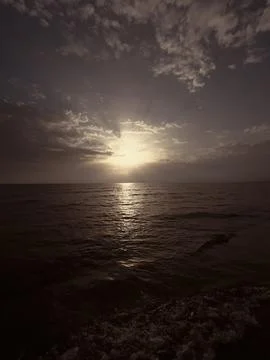 Waves on the beach in Italy with dramatic sky Foto stock