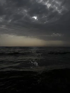 Waves on the beach in Italy with dramatic sky Stock Photos