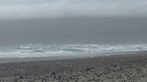 Waves on the beach - overcast Stock Footage 49640444