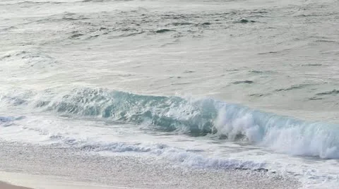 Waves on the beach - panning Stock Footage