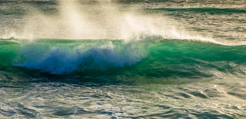 Waves at the beach Stock Photos