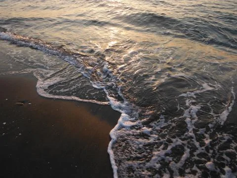 Waves on a beach Stock Photos
