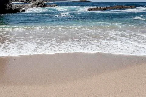 Waves at the beach. Stock Photos