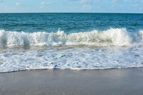 Waves on beach Stock Photos