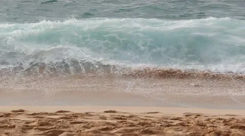 Waves on beach - random people walk by Stock Footage 14812876