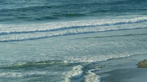 Waves on beach with Red camera Video stock 502667