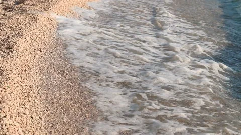Waves on beach with sand in summer. Waves breaking on shore Stock Footage 235030178