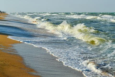 Waves on the beach shore Stock Photos