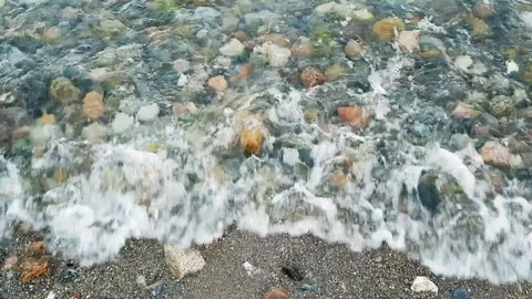 Waves on the beach with stones. Stock Footage 92743594