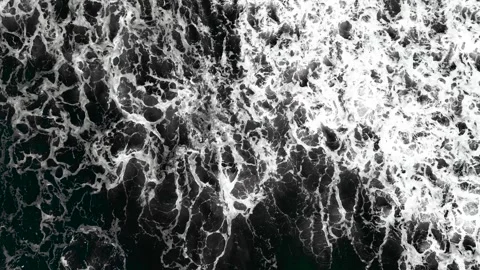 Waves at the beach on storm day aerial drone view Video stock 270213609