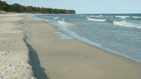 Waves on the beach on a summer's day Stockbeeldmateriaal 268958536