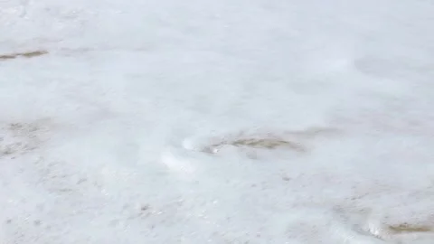 Waves on the beach with sunlight Stock Footage 303883719