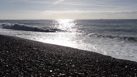 Waves on the beach on a sunny day Stock Footage 103437075
